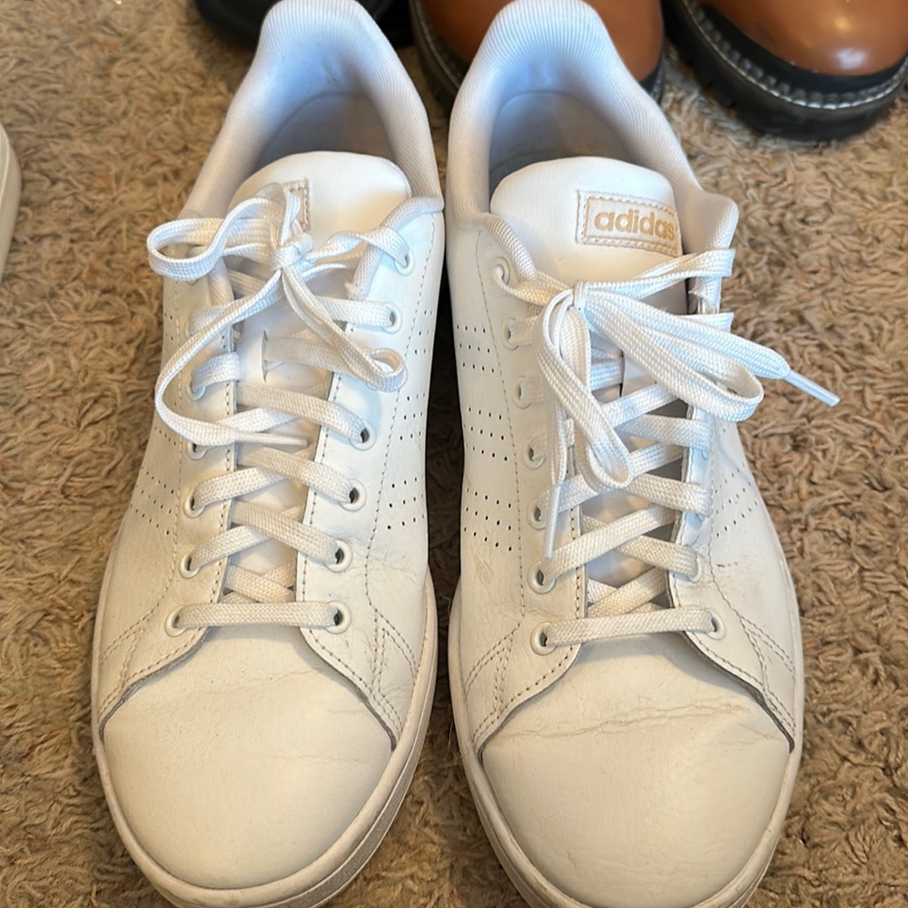 All white Adidas sneakers